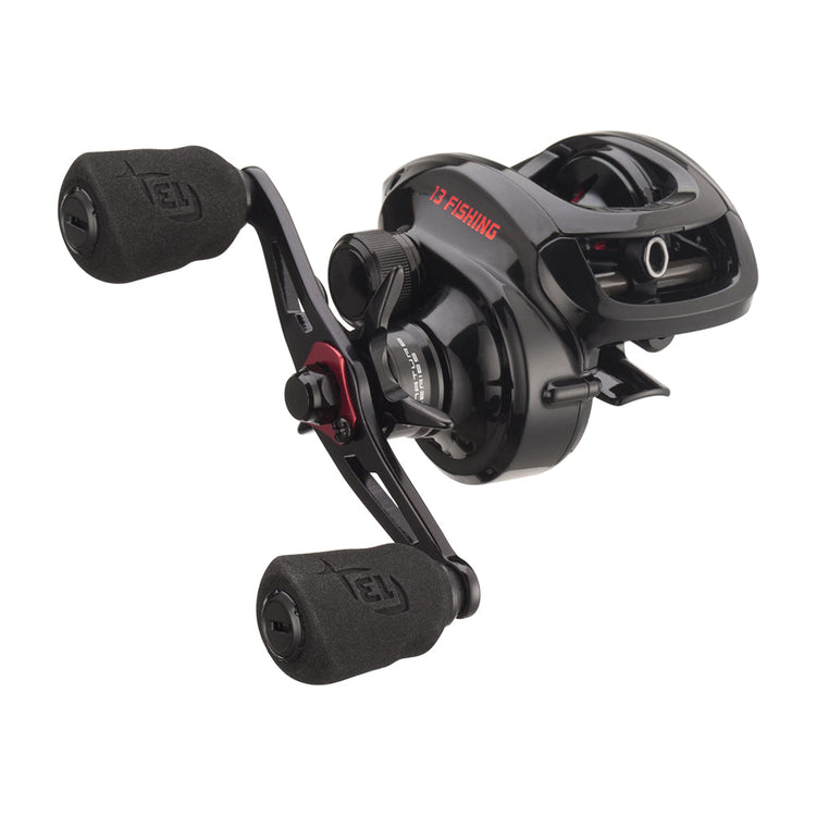 A black baitcasting fishing reel with ergonomic grips and red accents, designed for smooth performance. The reel features a sleek, compact body with visible branding on the side.