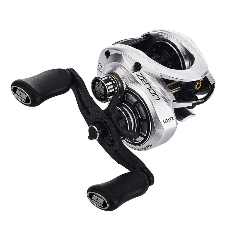 Close-up of a silver and black fishing reel with the brand name "Zemon" visible. It features dual handles and a sleek, modern design.