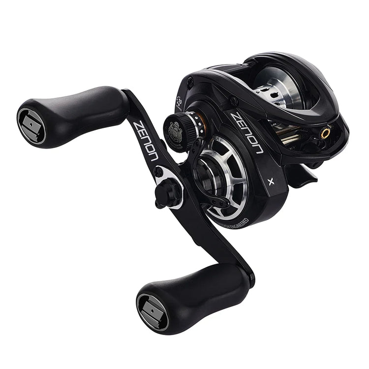 A black and silver fishing reel with two handles, labeled "ZENON.