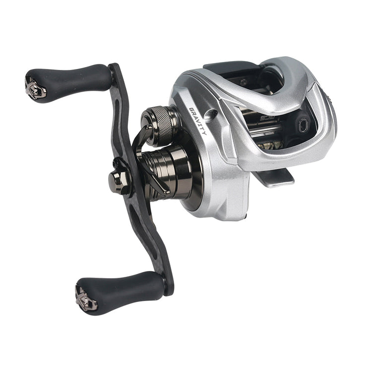 Silver baitcasting fishing reel with black handles and visible internal gears, set against a white background.