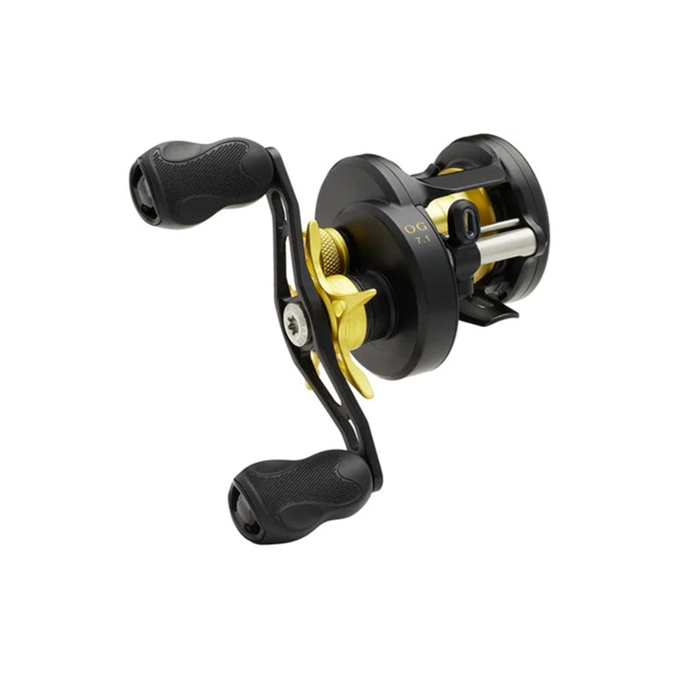 A black and gold fishing reel with dual handles on a white background, showcasing detailed design and textured grips.