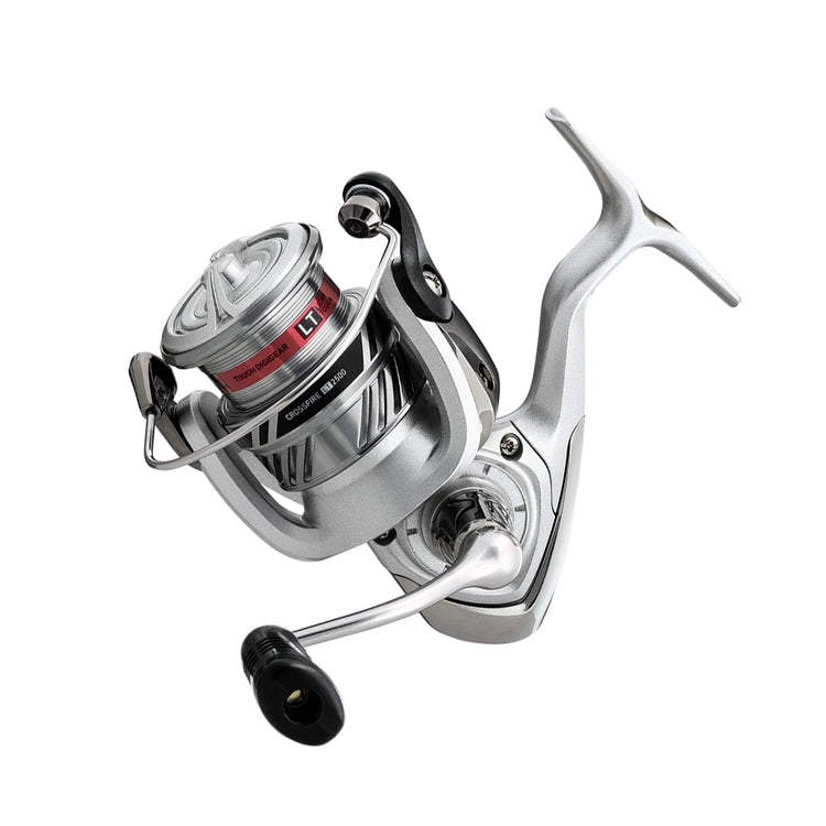 Silver fishing reel with a black handle, featuring a red accent on the spool. It has a sleek, modern design and is positioned with the handle extending outward.