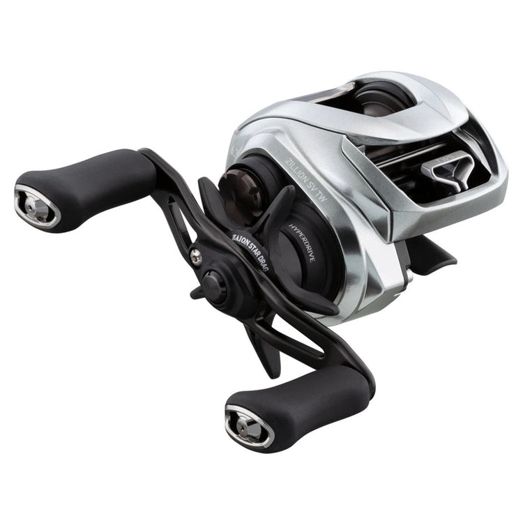 A silver and black fishing reel with a sleek design, featuring dual handles and detailed components. The reel has visible text indicating model or brand specifications.