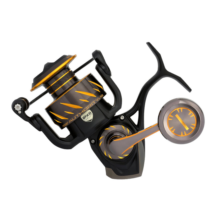 A black and orange spinning fishing reel with dynamic design elements, including angular accents and a detailed handle, displayed on a white background.