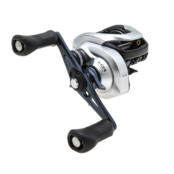 A silver and black fishing reel with dual handles and a modern design, angled to display its ergonomic grip and intricate components.