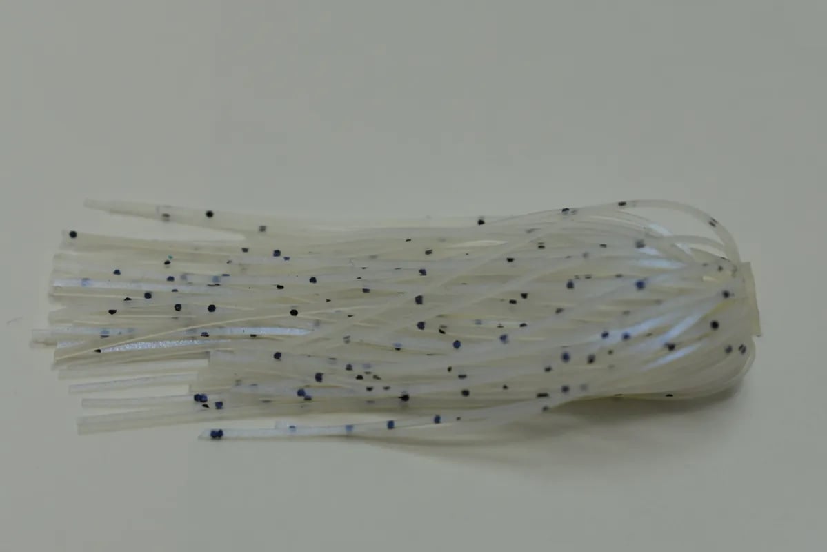 A close-up of an Accent River Special Spinnerbait reveals a translucent rubber lure with speckled, curling strands like a jellyfish or worm. Against an off-white background, it's perfect for crafting irresistible spinnerbaits and evoking the thrill of the Bassmaster Classic.