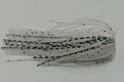 Close-up of translucent, flexible strips with black speckles, resembling thin rubber bands. Ideal for crafting Accent River Special Spinnerbaits by Accent; these strips lie stacked on a neutral background, ready for the next Bassmaster Classic tournament.