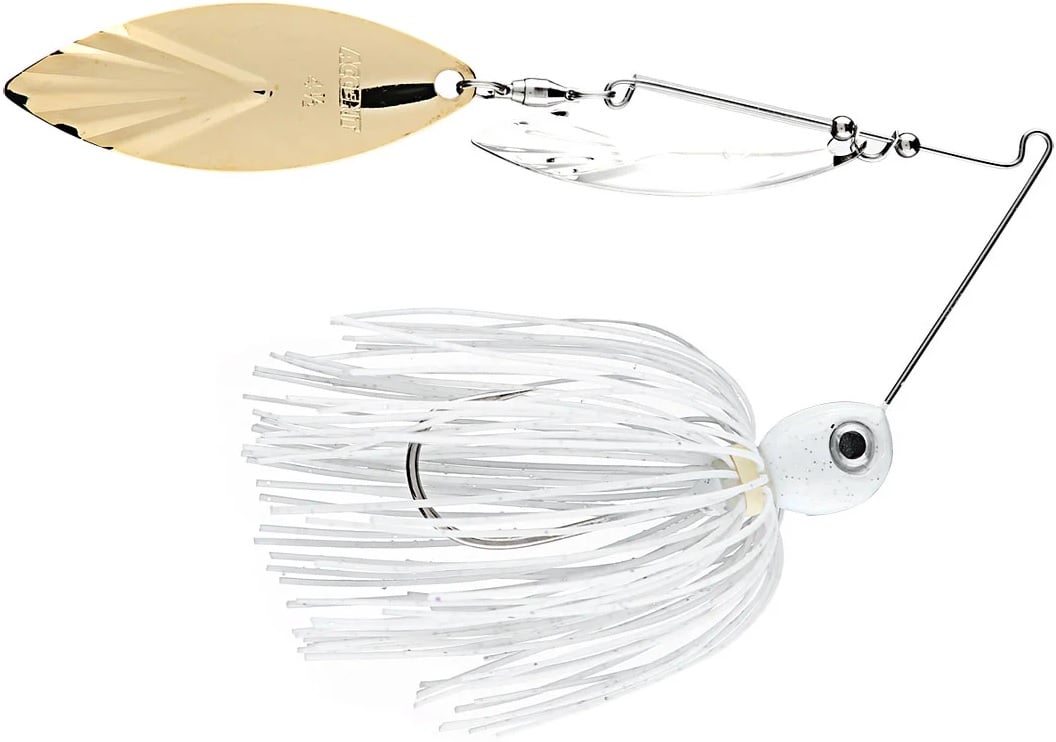 The Accent River Special Spinnerbaits by Accent features a white skirt and twin metal blades, one gold and one silver. Designed for peak performance, its hook is hidden within the skirt strands, making it ideal for Bassmaster Classic anglers.