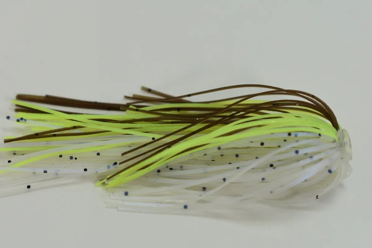 The Accent River Special Spinnerbaits, by Accent, features a Double Willow lure with yellow, brown, and translucent strands dotted with black spots. Designed to mimic a small fish or insect on a light background, it's perfect for Bassmaster Classic enthusiasts.