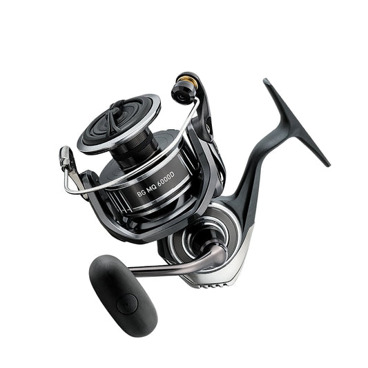 The Daiwa BG MQ 6000D-H 5.7:1 Spinning Reel, a sleek black design with a silver handle, is displayed on a white backdrop. Its monocoque body and precision craftsmanship make it ideal for saltwater fishing adventures. Model BGMQ6000D-H guarantees quality performance from the renowned brand Daiwa.