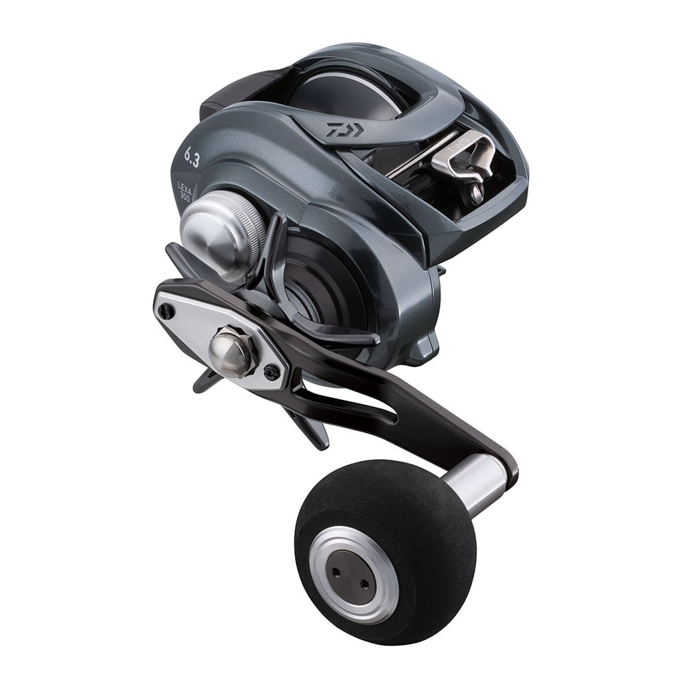 The Daiwa Lexa TW Casting Reel 300-P 6.3:1 | LX-TW300-P, ideal for saltwater fishing, features a sleek black and silver design with a curved handle and large round knob. Its T-Wing System and visible gear components ensure precise casting with smooth tension adjustment dials.