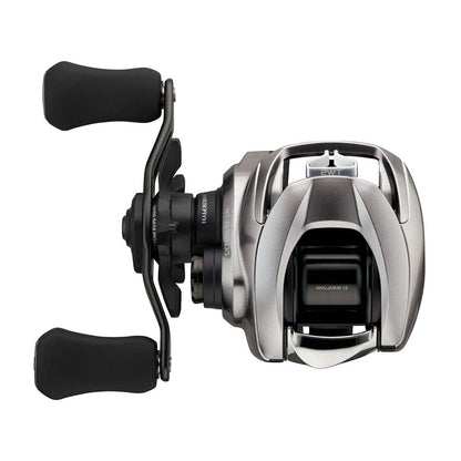 The Daiwa Zillion SV TW 2021 Casting Reel Left Hand 7.1:1 features HYPER DRIVE DESIGN with black handles, a compact design, ergonomic grips on a curved crank, and visible adjustment knobs. It boasts a sleek metallic finish and the advanced SV BOOSTER SYSTEM.