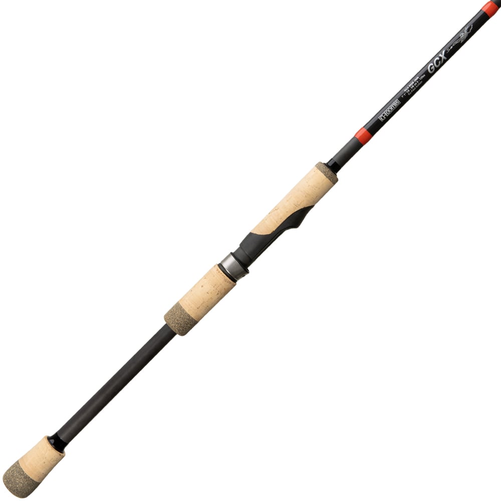 The americanlegacyfishing G. Loomis GCX Jig & Worm Spinning Rod 852S JWR 7'1" Medium | 12960-01 is a lightweight rod with a stylish black body and cork handle grips. Its modern design features a visible label near the handle, enhancing its visual appeal. Equipped with Multi-Taper Design technology, this spinning rod delivers exceptional performance for anglers.