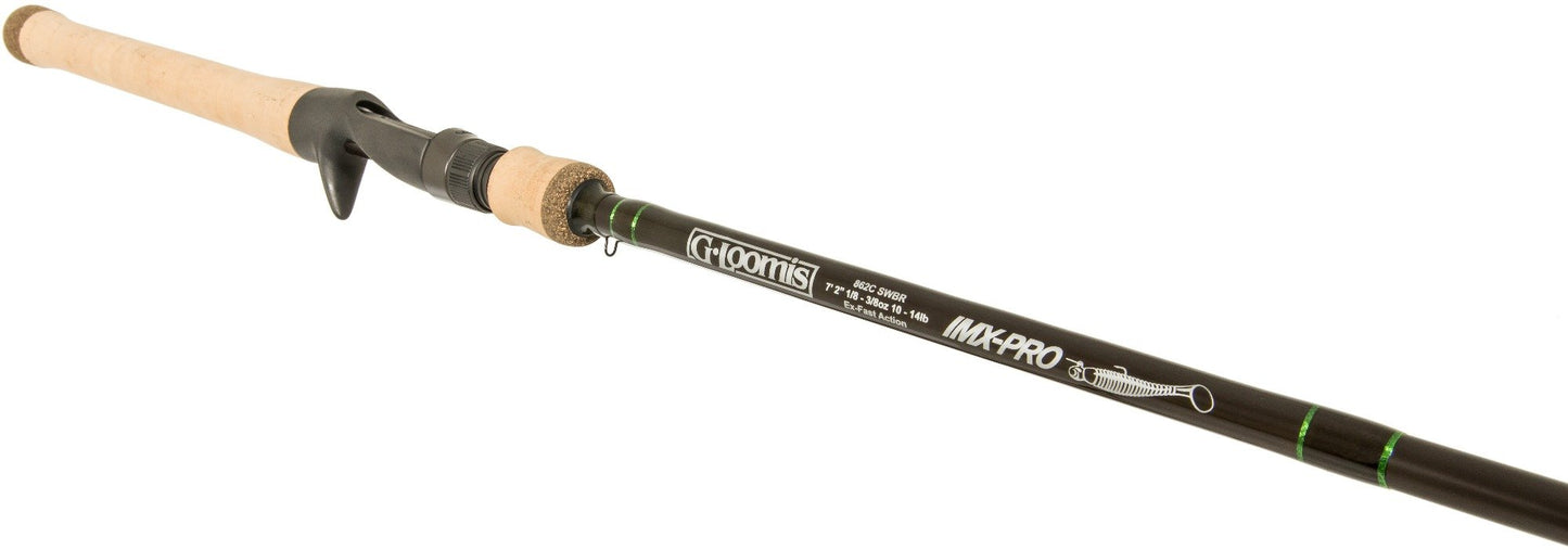 The G. Loomis IMX-PRO Swimbait 863C SWBR 7'2" Medium Heavy Casting Rod from American Legacy Fishing showcases a black body adorned with white lettering and green accents, ideal for swimbait enthusiasts. Its handle is made from light-colored cork, providing a comfortable grip for every angler.