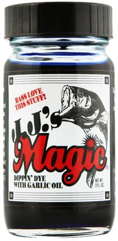 The 2 fl. oz. bottle of JJ's Magic Dippin' Dye with Garlic Oil features a fish graphic and "Bass love this fish attractant!" on the label, perfect for enhancing soft plastic baits, with a secure black lid.