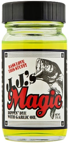 A 2 fl oz jar of green JJ's Magic Dippin' Dye with Garlic Oil, featuring a fish on the label and the text "Bass love this fish attractant!" Perfect for soft plastic baits.