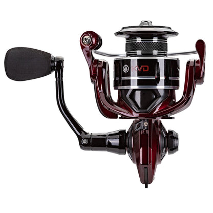 A close-up of the Lew's KVD Spinning Series Spinning Reel 6.2:1 | KVD300 from americanlegacyfishing highlights its sleek black and maroon design. This fishing reel features a premium bearing system with an aluminum frame and a left-hand handle. Its glossy finish showcases a visible logo, with the spool and bail arm prominently displayed.