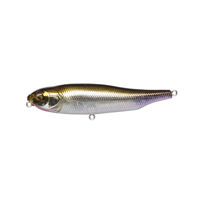 The Megabass Giant Dog-X by Megabass is a realistic fish-shaped lure with a metallic silver body, a gold-tinted head, detailed scales, a small fin, two line attachment loops, and a lateral tungsten balancer for improved performance.