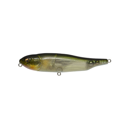 The Megabass Giant Dog-X is a realistic olive-green/silver fishing lure resembling a small fish. It has detailed scales, a transparent body, and metal rings for lines. Its lateral tungsten balancer provides precise roll-walking action, flawlessly mimicking baitfish.