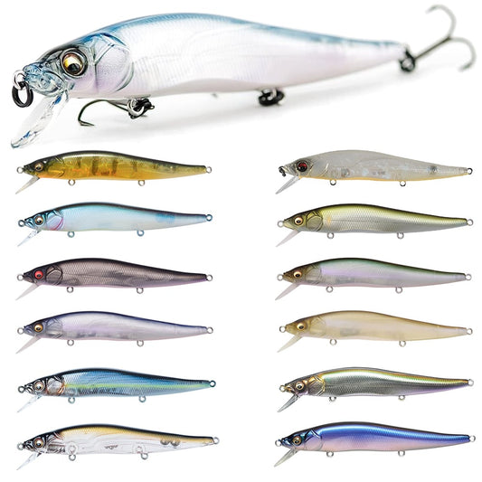 An assortment of eleven Megabass Vision 110 Jerkbaits by Megabass is displayed in two columns, highlighting a range of metallic and translucent colors such as blue, gold, purple, and silver. Each lure is equipped with unique eye details and Katsuage Out-Barb Trebles hooks for enhanced performance.