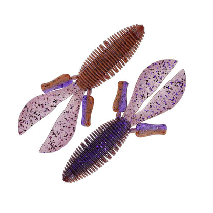 Featuring ribbed bodies and dual tail designs, two Missile Baits D Bomb creature bait lures from Missile Baits are adorned with black speckles on their purple sections. They're ideal for pitching and flipping, arranged diagonally opposite each other on a white background.