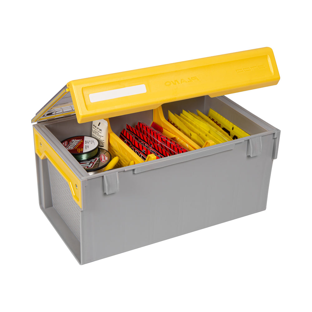 A Plano Edge Plastics Box | PLASE800 by Plano is shown in gray and yellow, with a partially open lid revealing organized compartments. It's perfect for anglers, storing items like packets with red and yellow labels.