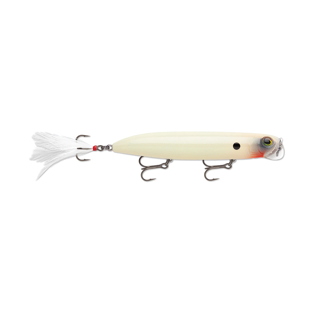 Meet the Rapala PXR Jowler, a white Precision Xtreme Series fishing lure with a fish-like design and distinctive black head dot. Equipped with two treble hooks and a fluffy white tail tassel, this surface bait promises exceptional allure.