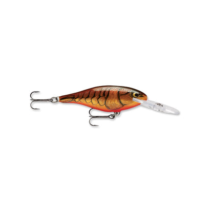 The Rapala Shad Rap Crankbait by Rapala features a brown and orange fish-like design, clear plastic lip, and two treble hooks. It mimics a small baitfish with scales and fins to entice your catch.