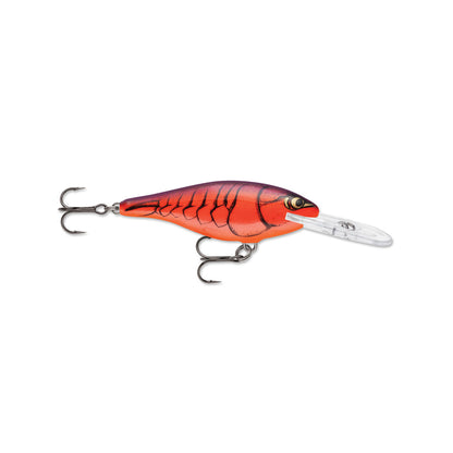 The Rapala Shad Rap Crankbait by Rapala features a red and black baitfish pattern, a plastic lip for diving, and two treble hooks strategically positioned at the head and tail. Its streamlined body with scale-like details enhances realism.