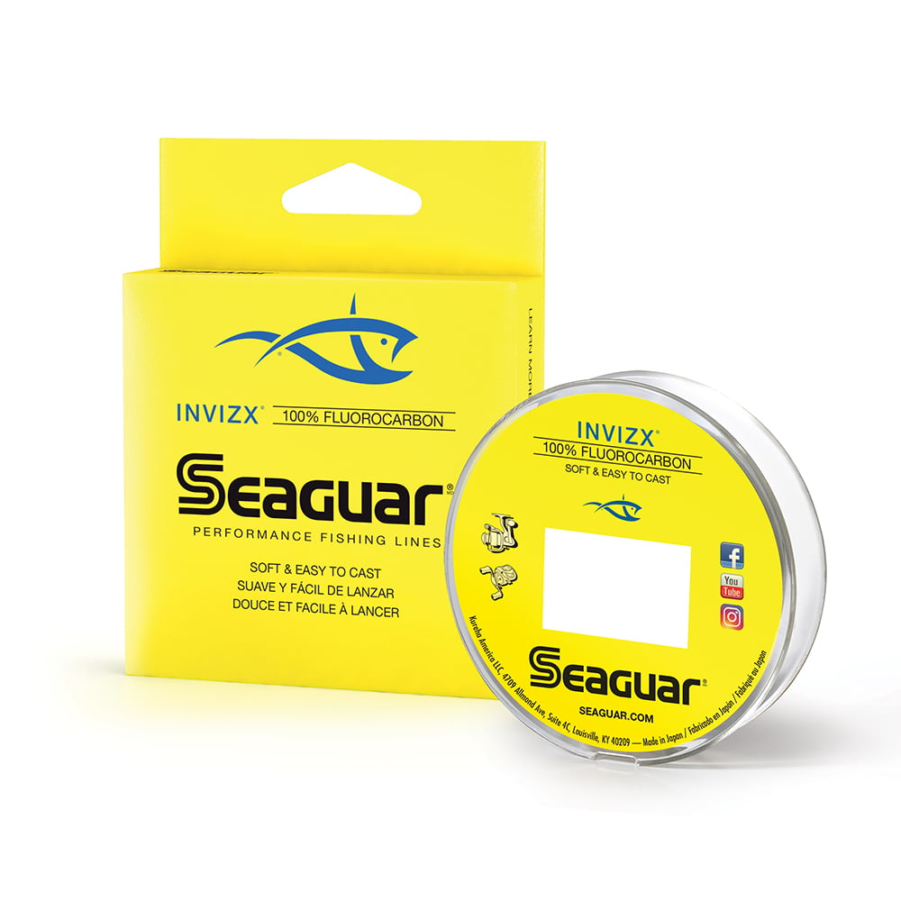 A yellow box and a spool displaying the "Seaguar InvizX Fluorocarbon Line" feature a blue fish logo with the phrase "Soft & Easy to Cast" written in multiple languages, providing superior sensitivity for an outstanding fishing experience.