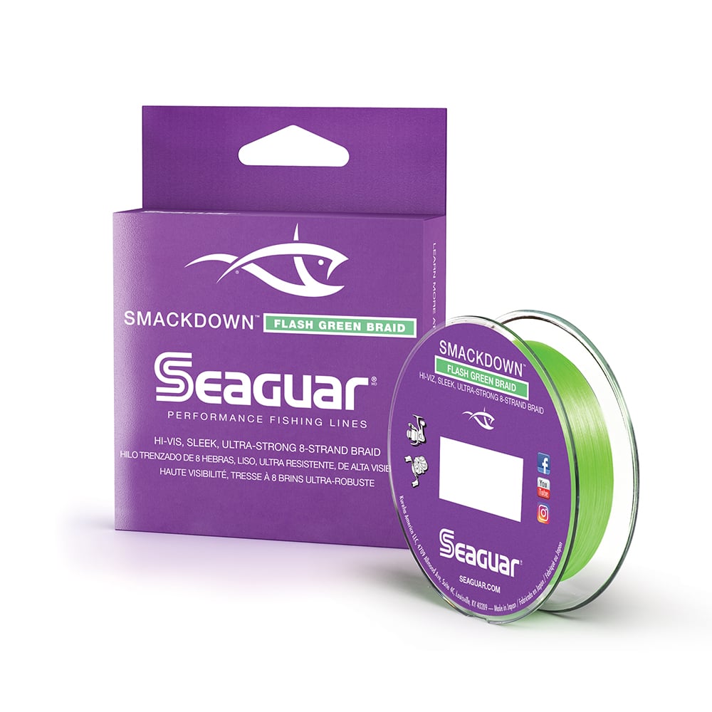 The Seaguar Smackdown Braided Line 150yd in flash green by Seaguar is presented in a striking purple box adorned with a white fish logo and text. It includes a bright green line on a clear spool, ideal for those looking for vibrant performance or opting for the Lo-Vis Smackdown Stealth Gray version when seeking stealthier options.