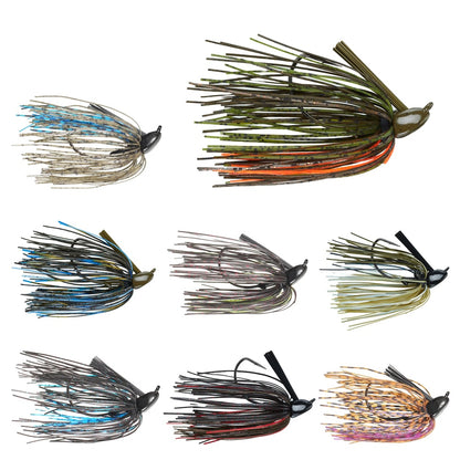 The image showcases eight Secret Lures MVP Flippin' Jigs by Secret Lures, each with a silicone skirt in mixed blue, green, orange, and brown hues. Featuring a weighted head and durable Mustad hook for optimal performance.