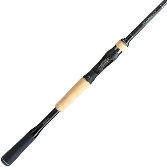 The Shimano Expride B Casting Rod 6'10" Medium | EXC610MB by American Legacy Fishing offers a sleek black design with a cork handle and ergonomic grip. Its Hi-Power X technology guarantees superior strength, and the tapering end showcases the streamlined structure, further enhanced by Carbon Monocoque construction.