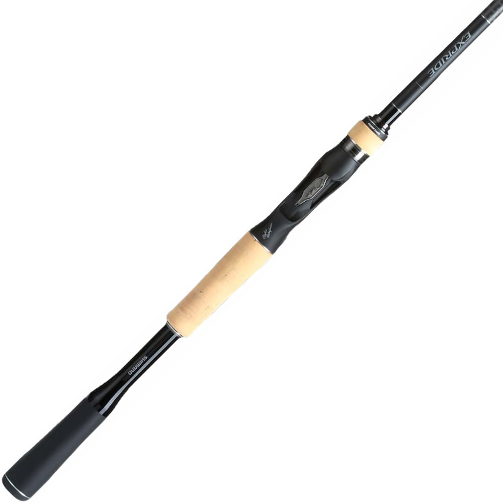 The Shimano Expride B Casting Rod 6'10" Medium Heavy | EXC610MHB by americanlegacyfishing combines Hi-Power X technology with a sleek black and beige design and a cork handle, beautifully contrasted against a white background.