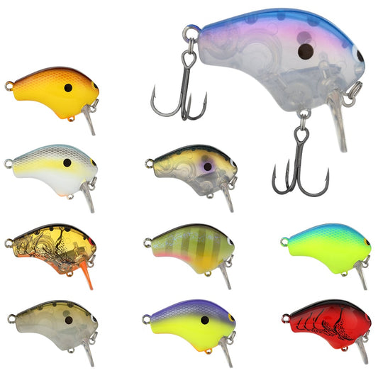 A set of nine vibrant wake baits, showcasing diverse designs and color schemes like yellow, blue, green, and red. Each lure is modeled after the Shimano Macbeth Shallow 50F Wake Bait by Shimano, featuring a Hybrid Edge round bill and treble hooks, all presented against a white background.