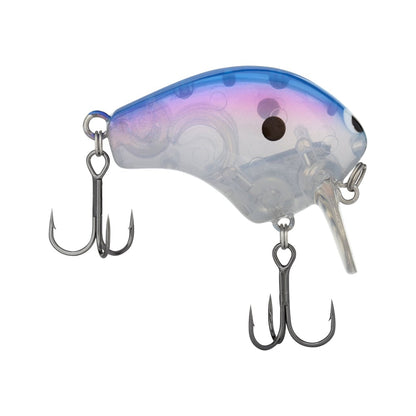 The Shimano Macbeth Shallow 50F Wake Bait is a transparent crankbait featuring a curved body with blue and pink gradient hues on top and a silver underside. Its Hybrid Edge round bill design enhances its appeal, completed with two treble hooks attached below.