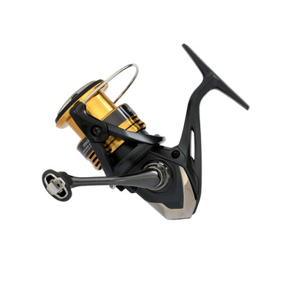 A close-up of the Shimano Sahara FJ Spinning Reel 2500FJ by americanlegacyfishing, featuring elegant black and gold accents. The handle and line spool are prominently displayed, showcasing the HAGANE Gear's sleek and durable design elements against a white background.