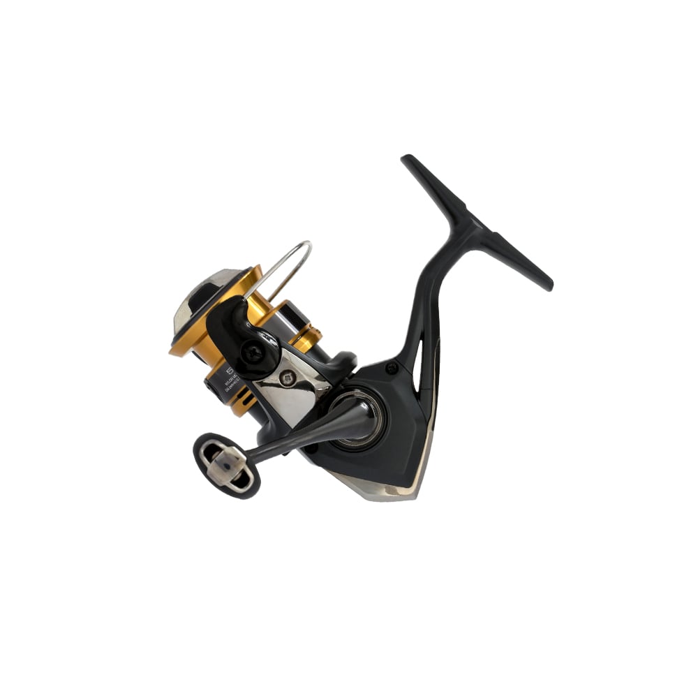 The Shimano Sahara FJ Spinning Reel 500FJ, by americanlegacyfishing, flaunts its black and gold design on a white background, highlighting the handle, spool, and spinning mechanism with HAGANE Gear.