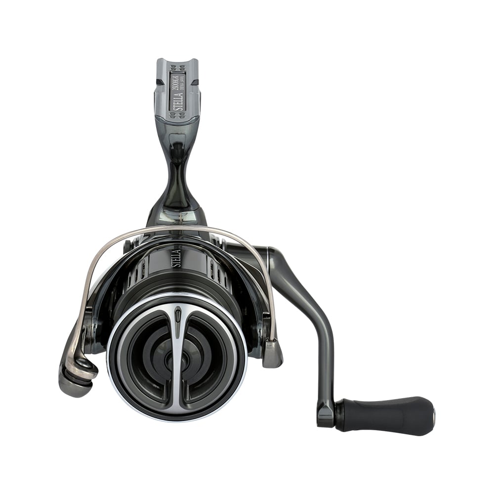 The Shimano Stella FK Spinning Reel 1000FK from americanlegacyfishing boasts a right-side handle, sleek design with metallic accents, and MicroModule II technology. A prominent circular drag adjustment knob at the center completes its modern look.