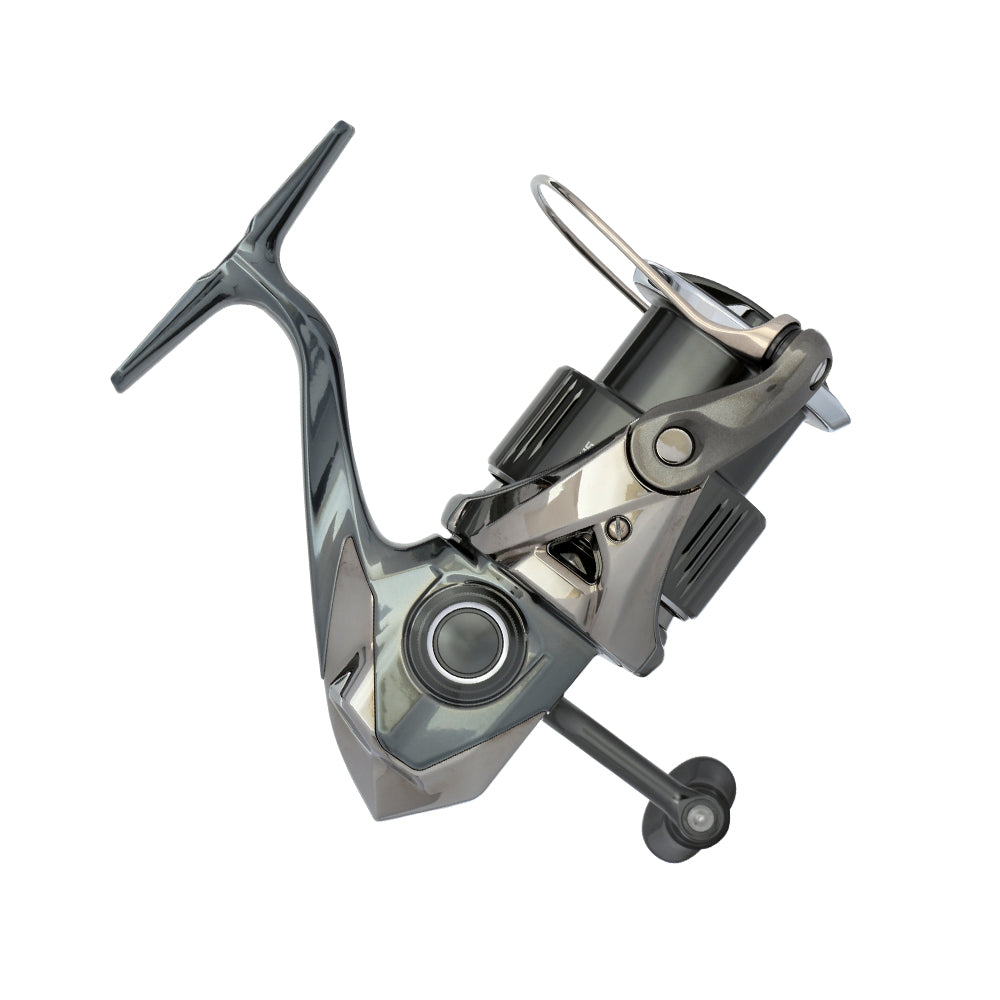 The Shimano Stella FK Spinning Reel 1000FK STL1000FK by americanlegacyfishing features a sleek modern design with a side handle, balanced arm, and polished finish. Its intricate detailing is enhanced by MicroModule II technology for seamless operation.