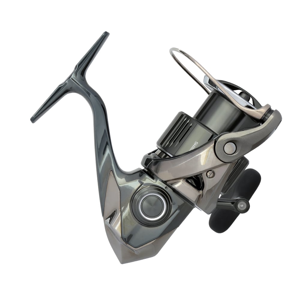 A modern Shimano Stella FK Spinning Reel 4000XGFK, from americanlegacyfishing, is shown in gray and silver against a white backdrop. It highlights an InfinityDrive technology-enhanced handle and spool for boosted performance.