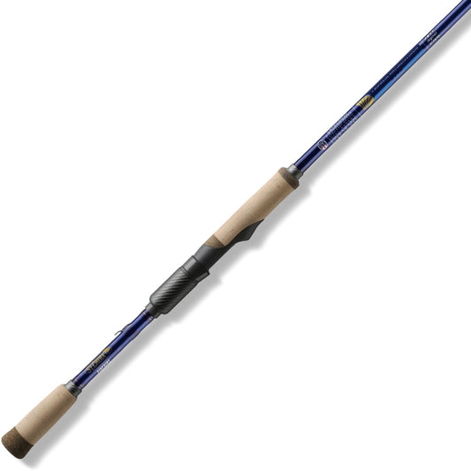 The St. Croix Legend Tournament Bass 6'8" Medium Pinpoint Spinning Rod from americanlegacyfishing features a sleek design with a blue finish, cork handles, SCIV+ Carbon Fiber construction, and metallic reel seat and guides. It's artfully displayed diagonally against a white background.