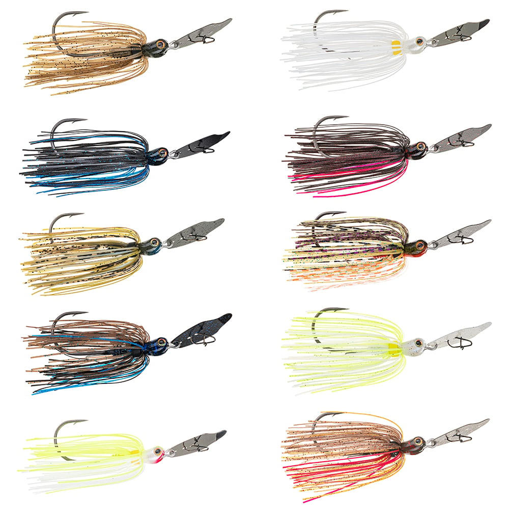 The image displays a bass angler's collection featuring ten varied fishing jigs, including bladed swim jigs like the Strike King Thunder Cricket Vibrating Jig. Each jig is decorated with a rubber skirt in bright colors such as brown, white, and blue and is arranged in two vertical columns for easy comparison.