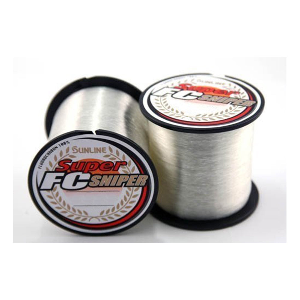 Two spools of Sunline Super FC Sniper 660yd fishing line are displayed. Both feature clear, translucent lines with labels showcasing the Sunline brand and logo. Known for their versatility and abrasion resistance, one spool stands upright while the other is tilted slightly.