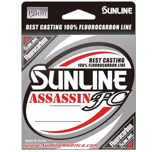 The packaging for the Sunline Assassin FC 225yd features "Best Casting 100% Fluorocarbon Line" with superior abrasion resistance, "Made in Japan," a red and black design enhanced by Pion Technology, and the iconic Sunline logo.