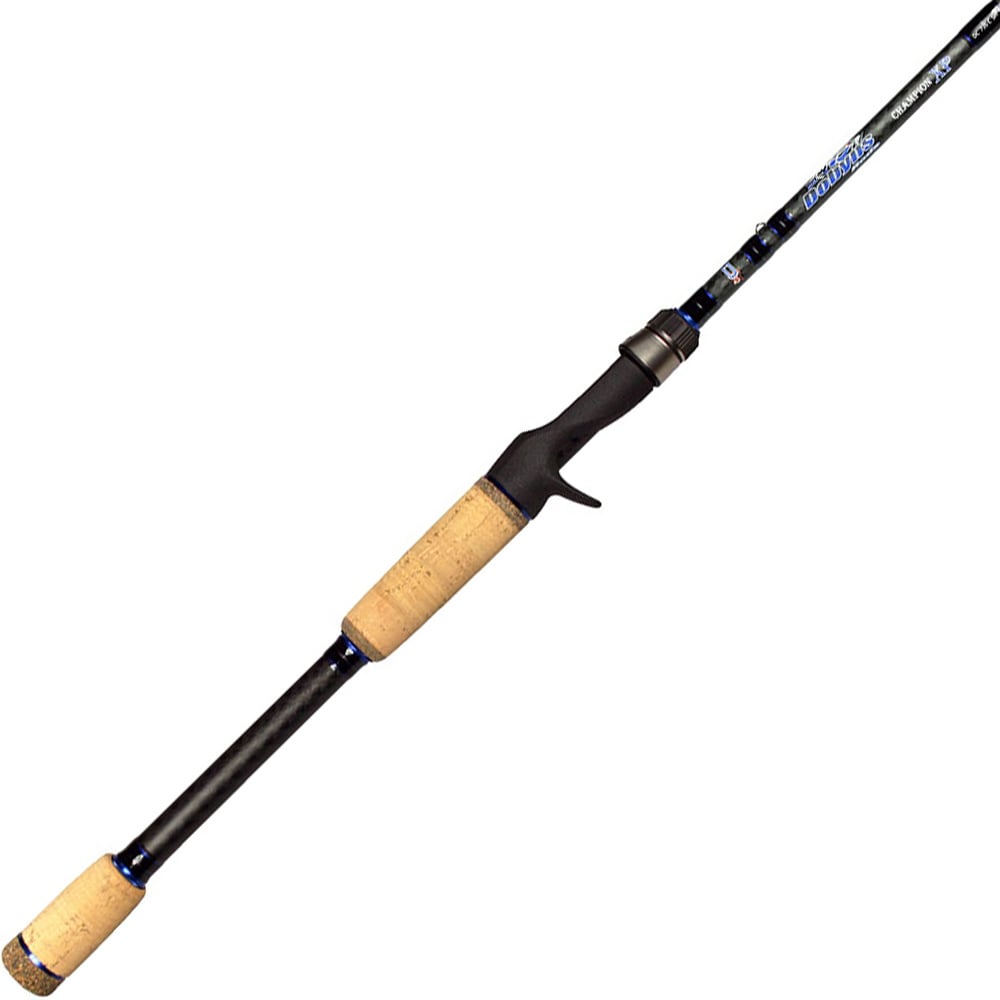 The Dobyns Champion XP 7'3" Medium Heavy X-Fast Casting Rod features a black body with cork handles, Fuji Guides, and a baitcasting reel seat. It boasts a sleek design and is angled diagonally with the tip pointing upward.