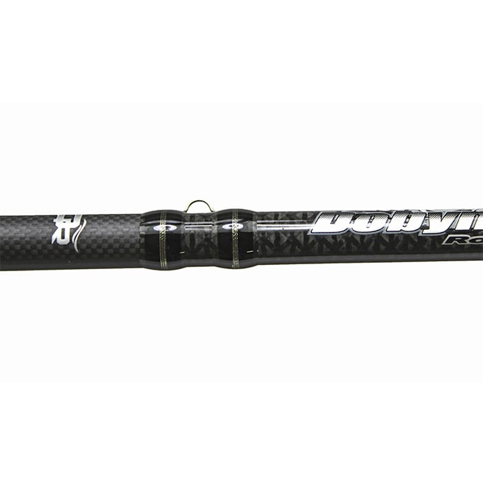 Close-up of a Dobyns Xtasy 7'2" Medium Heavy Casting Rod | DRX 723C, featuring its textured pattern. "americanlegacyfishing" is elegantly written in white cursive, accented by a sleek Fuji Torzite guide ring near the text.