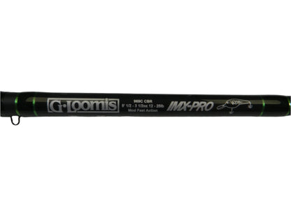 Close-up of an excellent condition black casting rod with white text that reads "G. Loomis IMX-PRO" and specifications: "969C CBR 8'0" XH," featuring green accents. Perfect for those in the Rod and Reel Trade-In Program seeking quality used gear or store credit options.