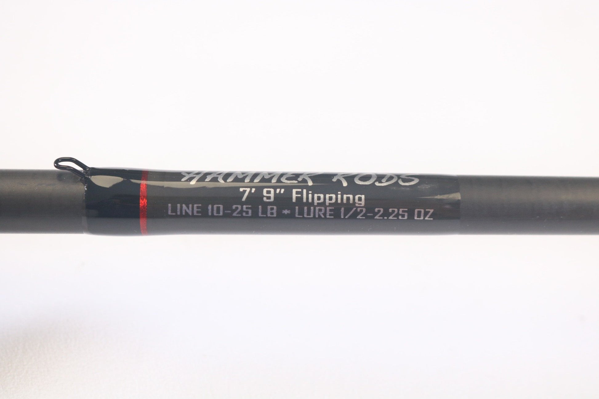 Close-up of a black section on the Hammer Rods Micro Guide Flipping 7'9" Heavy casting rod, labeled "LINE 10-25 LB" and "LURE 1/2-2.25 OZ." Consider trading your used gear through our Rod and Reel Trade-In Program for store credit!.