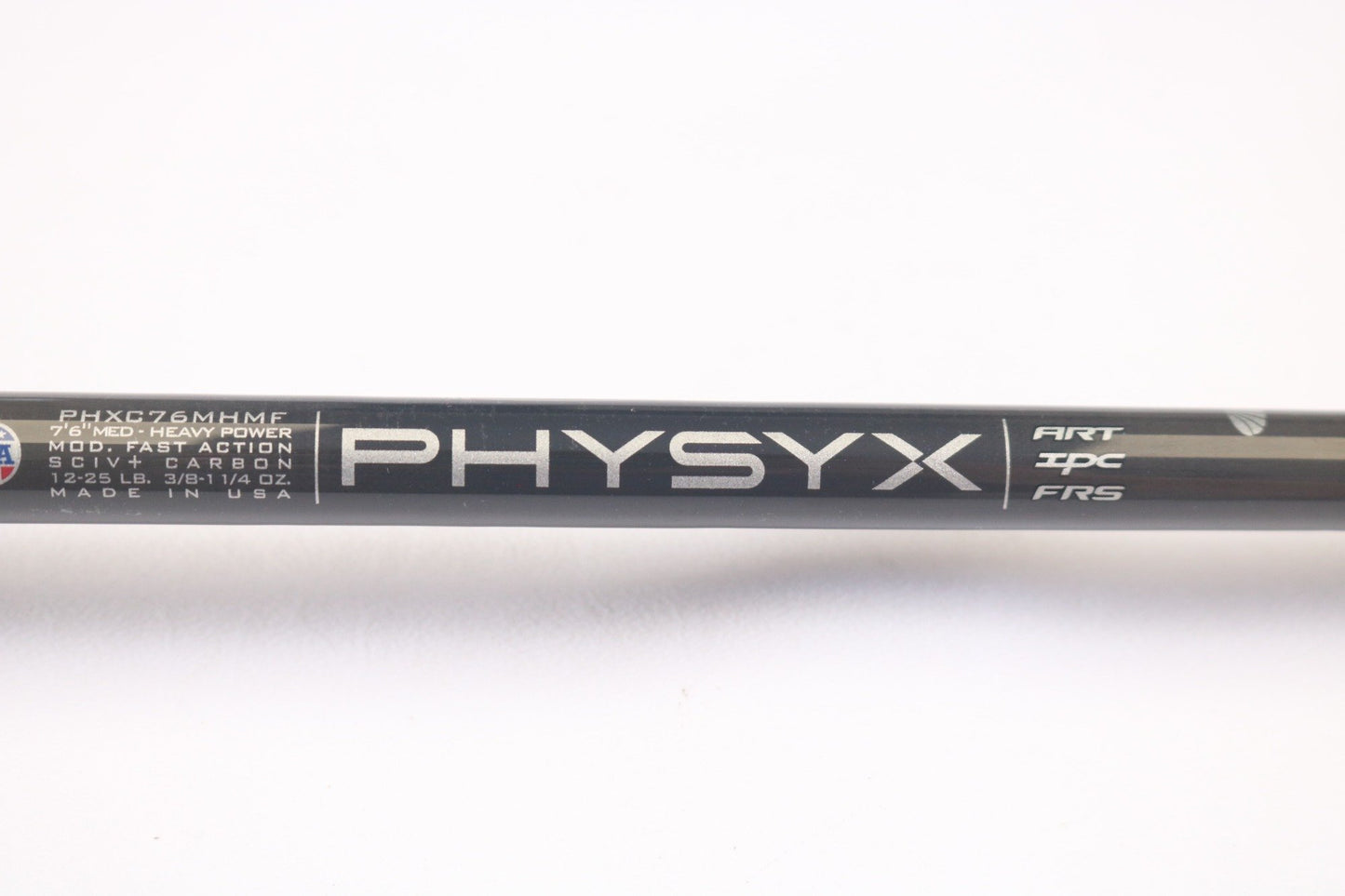 Close-up of a black St. Croix rod with "PHYSYX" in large letters. Specs like "PHXC76MHMF," "7'6" MED-HEAVY POWER," and "MOD. FAST ACTION" stand out, proudly made in the USA, featuring ART, IPC, and FRS—perfect for our Rod and Reel Trade-In Program with store credit options.